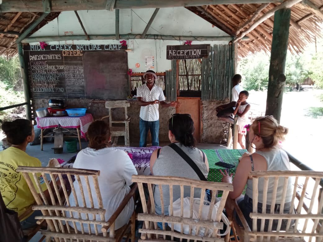 Guests, canoe experiences, cooking class and community moments at Mida Creek Nature Camp